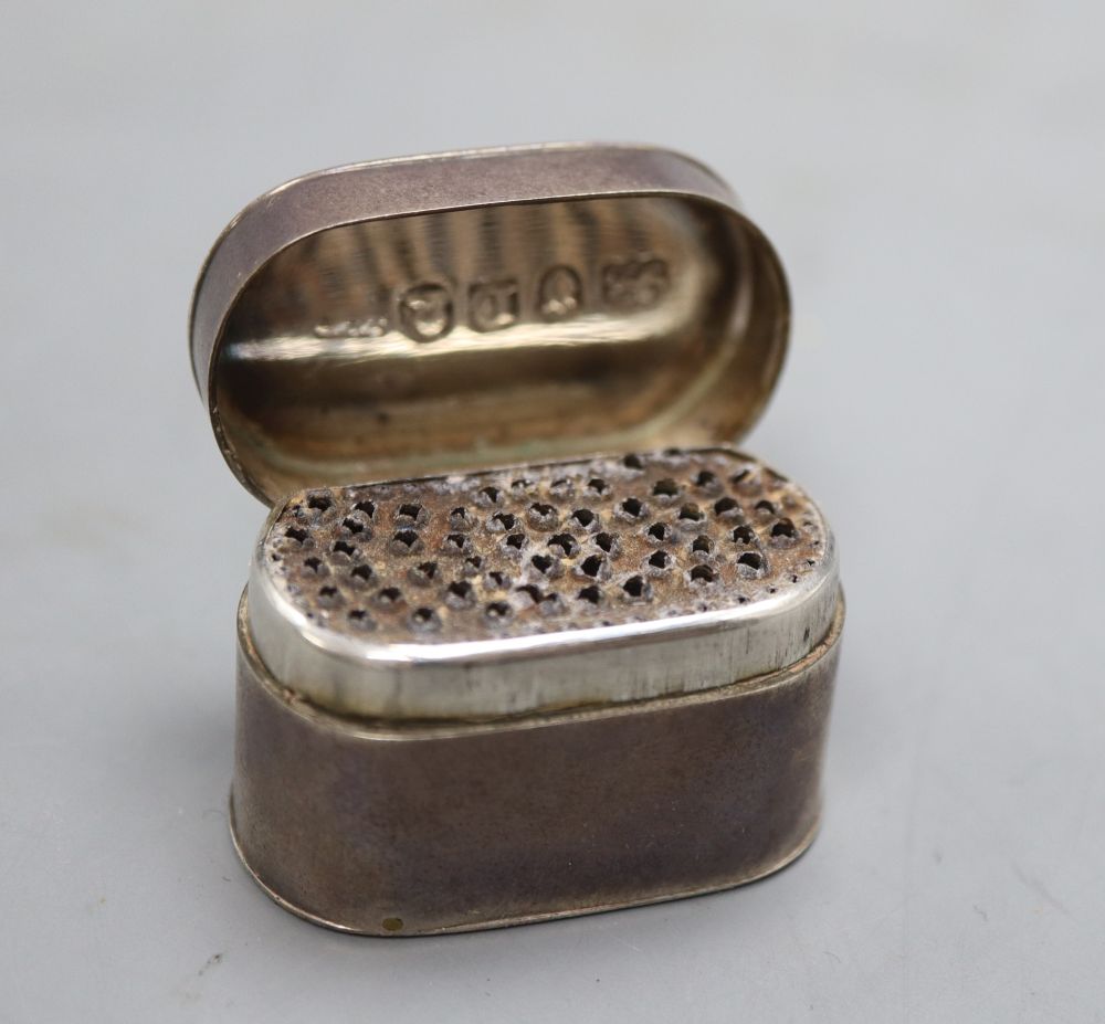A George III silver oval nutmeg grater, ?B over JM, London, 1806, 34mm.